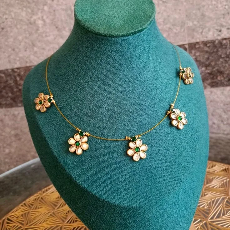 Gold Toned Floral Necklace with Green Kundan Stones