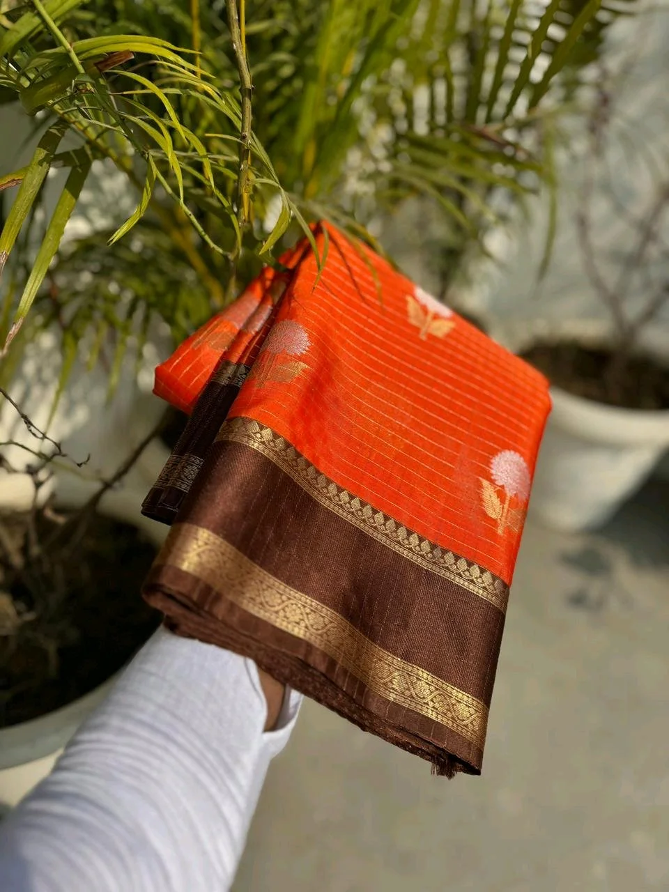 Orange Silk Saree with Brown Zari Border and Floral Buttis thumbnail 1