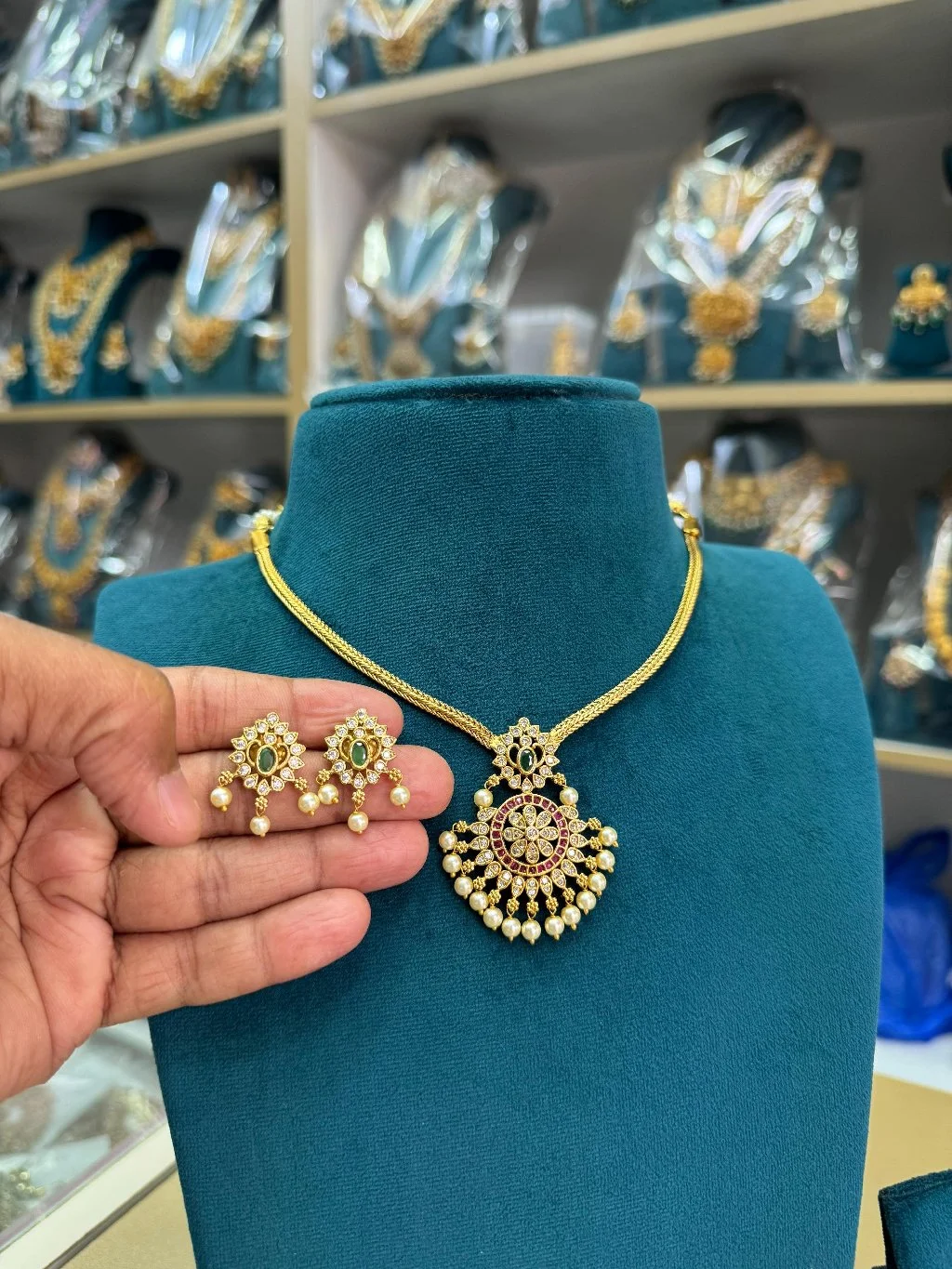 Gold Toned Traditional Necklace Set with Green Red Stones and Pearl Drops