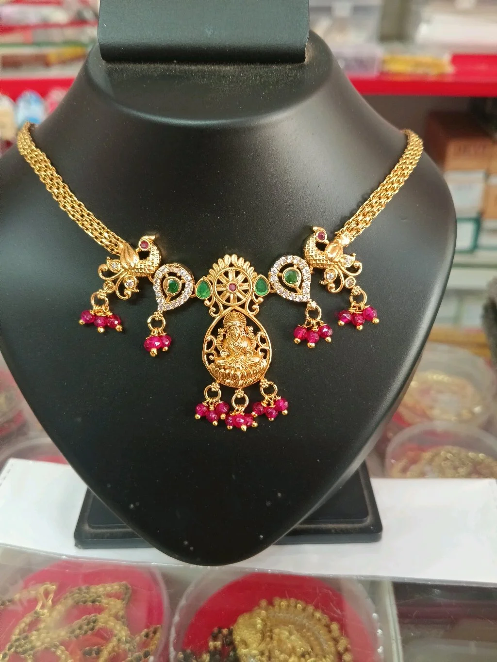 Gold Plated Lakshmi Peacock Necklace with Ruby Drops