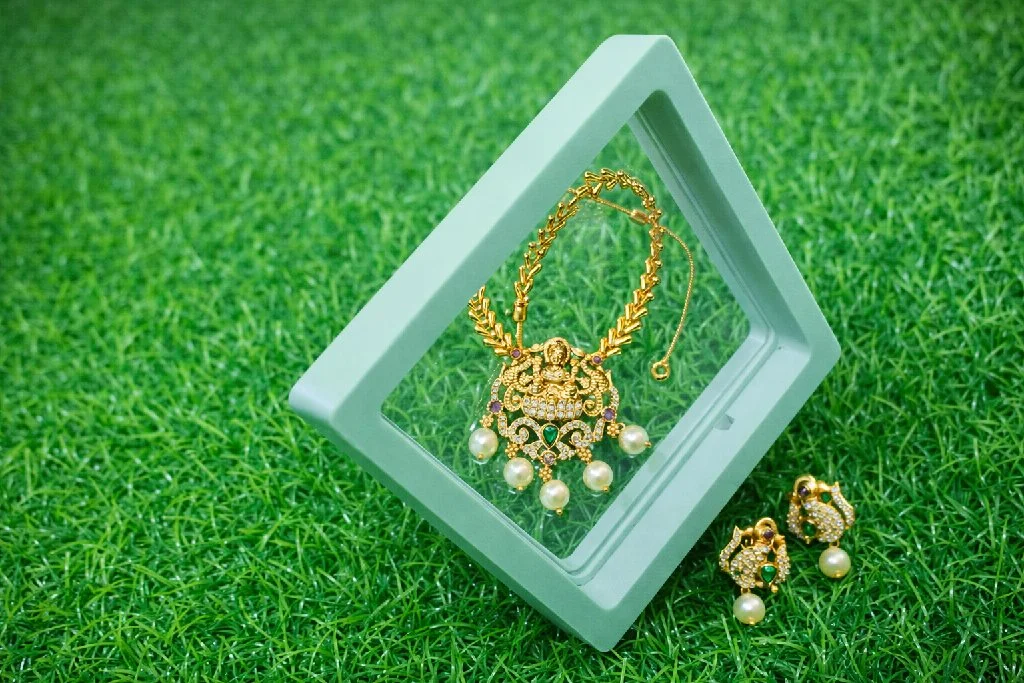 Gold Toned Lakshmi Temple Necklace with Green Pearl Drops And Earrings Best Quality 5