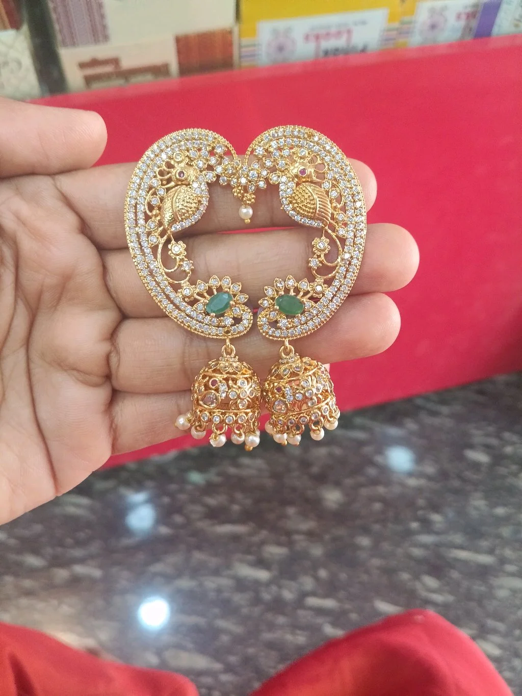 Gold Plated Peacock Design Jhumka Earrings with CZ and Emerald Stones