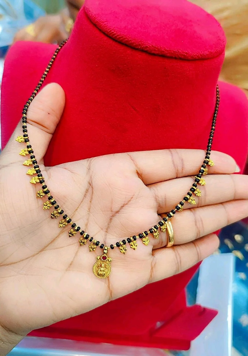 Black Beaded Gold Plated Mangalsutra with Deity Pendant
