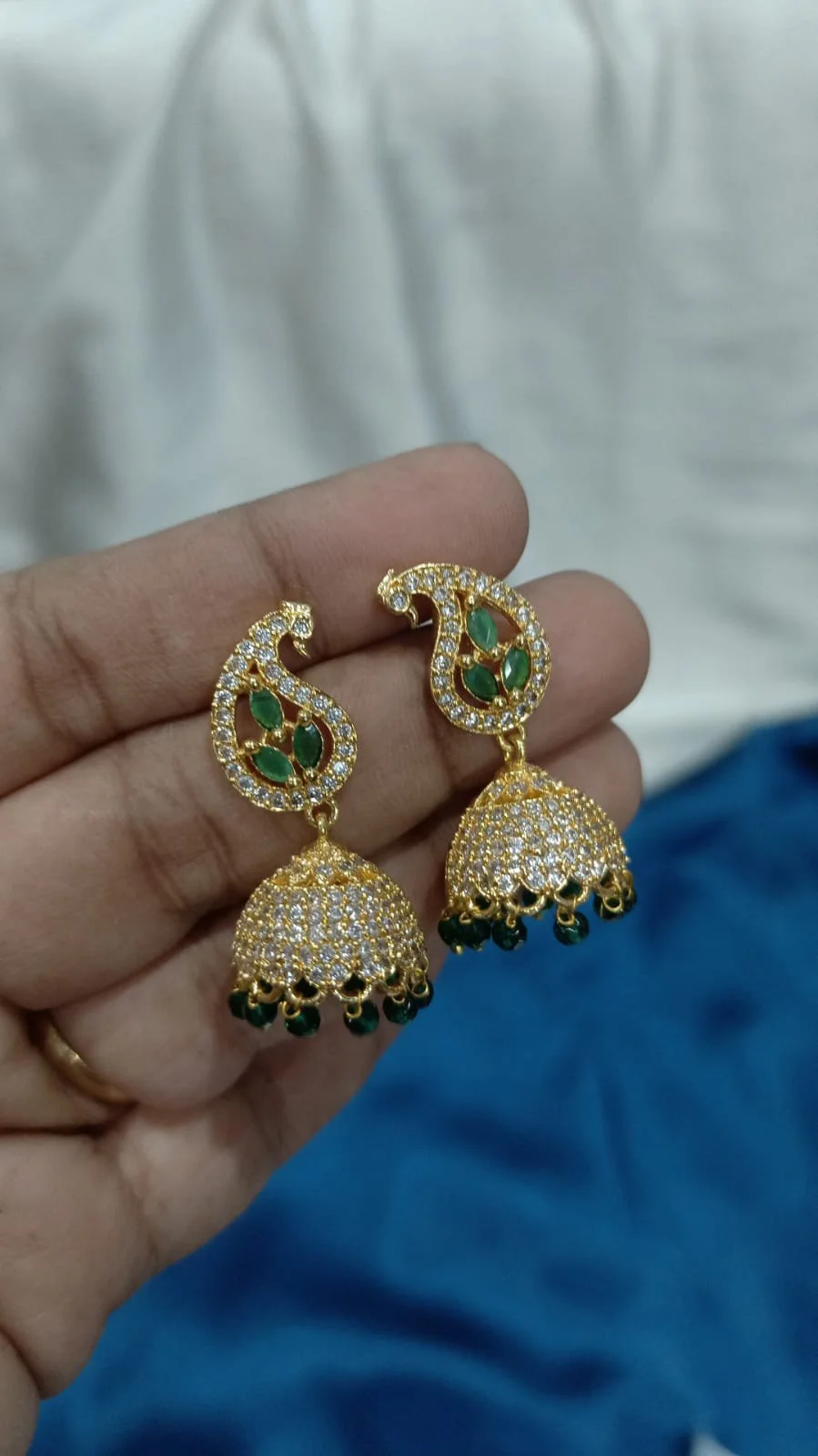 Gold Plated Paisley Jhumka Earrings with Green Stones