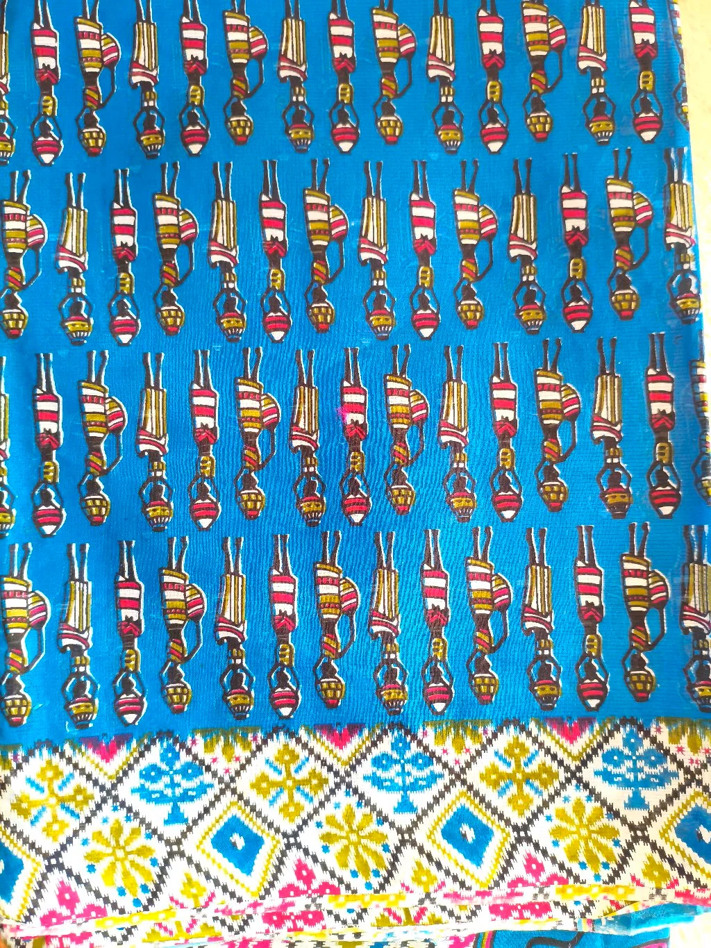 Blue Cotton Saree with Traditional Figures and Geometric Border