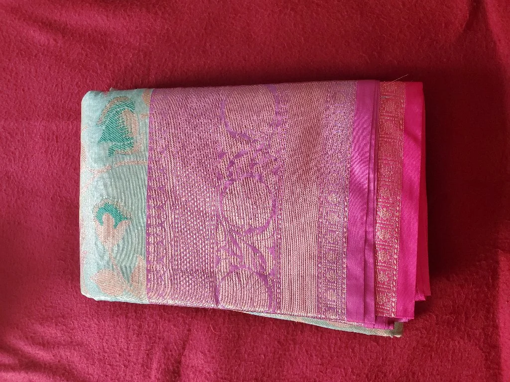 Floweral డిజైన్ Light Pistha Green With పింక్ Boarder Kanchi Tissue Saree. It హస Nice Zari and Malticolour thread Weaving Design With Matching Colours. thumbnail 1